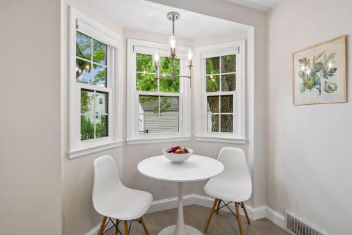 Sweet dining nook in the kitchen is great for keeping the chef company