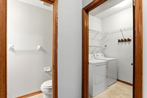 Main-floor convenience: a half bath for guests and a laundry room sit side by side, tucked just off the kitchen.
