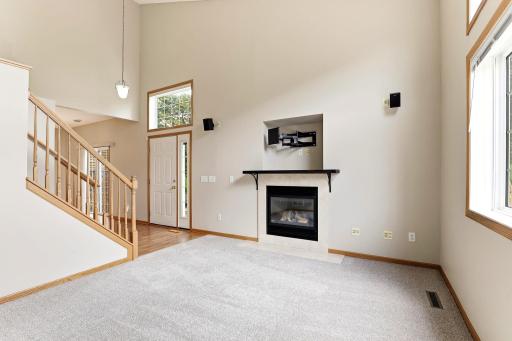 Vaulted ceilings stretch the great room upward, and the open oak staircase adds warm character. Ready for movie
nights and holiday gatherings alike.