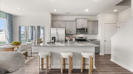 Designed for everyday living, the Tatum's kitchen blends style, function, and convenience. Photo of model home, colors and finishes may vary.
