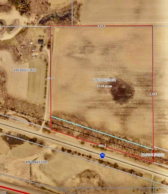 Subject property shown with red border. This outline represents +/- 19 acres after adding the recently acquired BNSF strip of land between it and County Road 75 to the original 16.98 acre parcel currently being shown on the County GIS site.