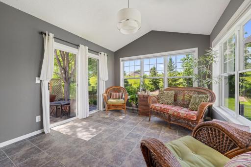 Relax after a long day in this beautiful sun room with sliding glass door that leads to your private patio.