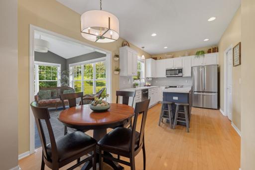 Gleaming hardwood floors flow throughout the main level, seamlessly connecting each room.