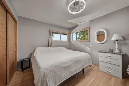 Main level bedroom ..great corner window views of lake