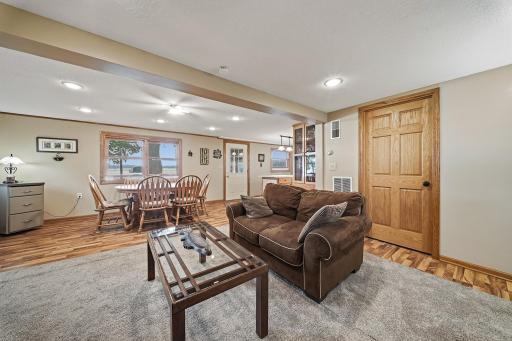 Living room area with door leading to bathroom and laundry room