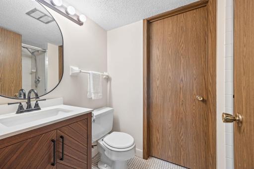 Downstairs bathroom has a shower and a new vanity, fixtures, and mirror! Laundry is conveniently next to it!