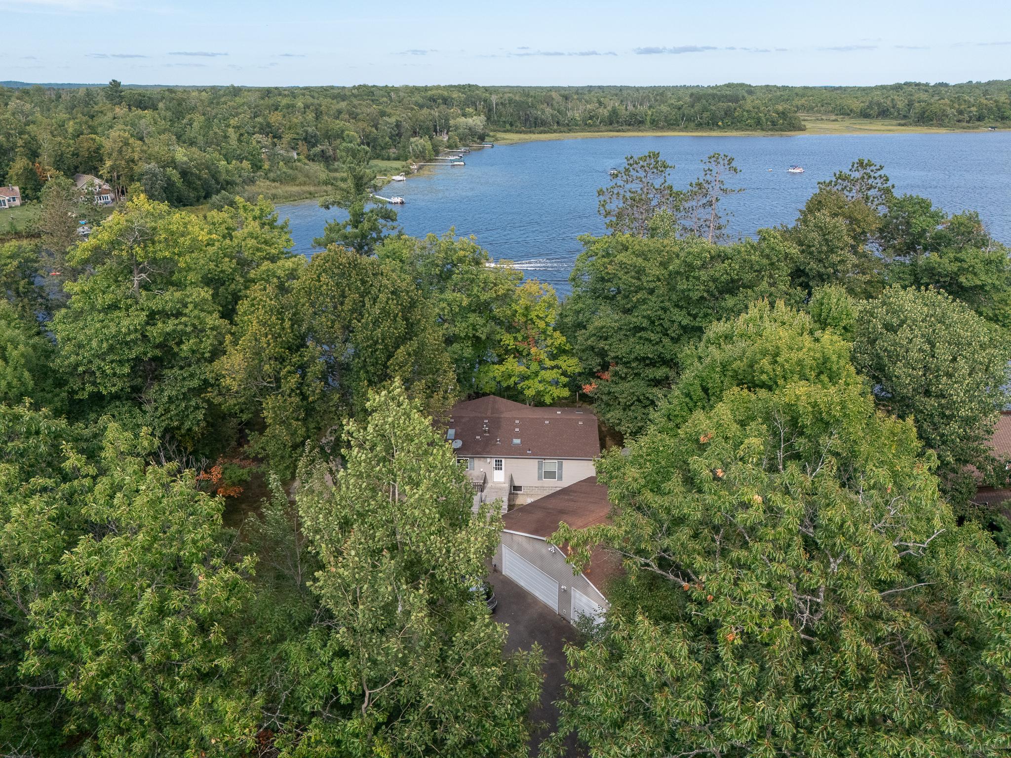 Aerial view of Mary Lake and property, nestled amongst trees for privacy