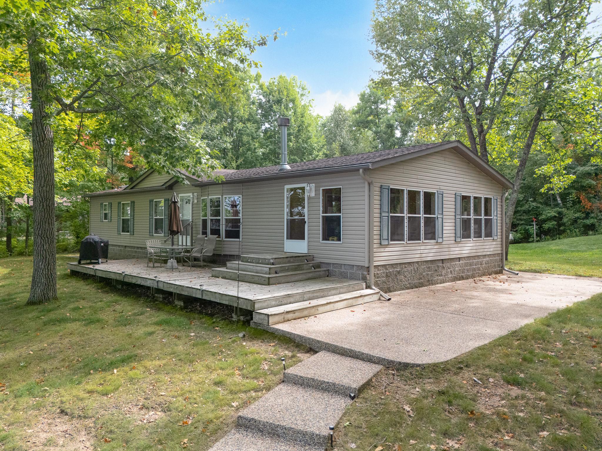 Stone patio and steps off deck. Solid block foundation for home