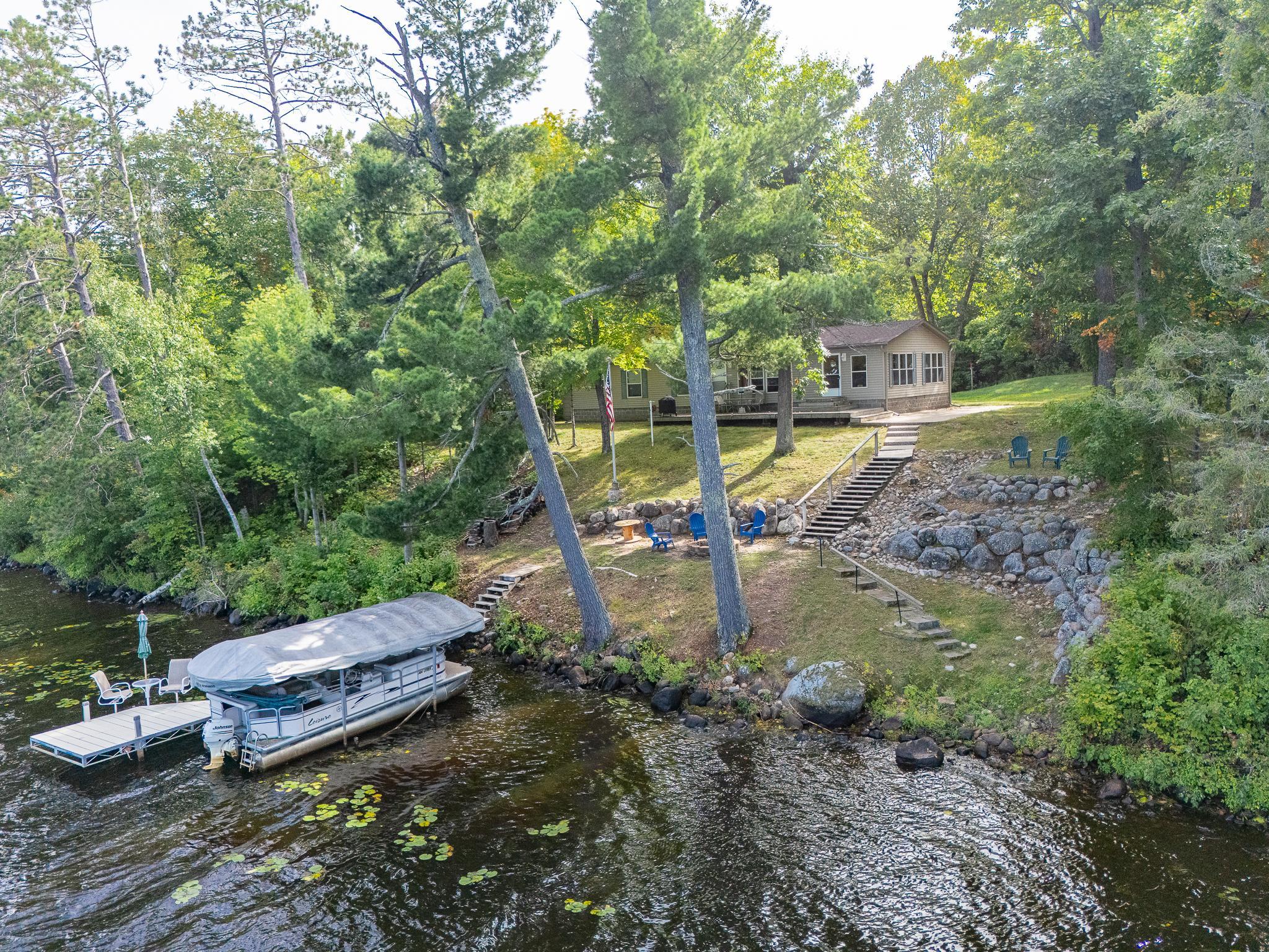 150 feet of hard lakeshore. Notice the stone retaining wall for rain runoff away from the lakeshore living