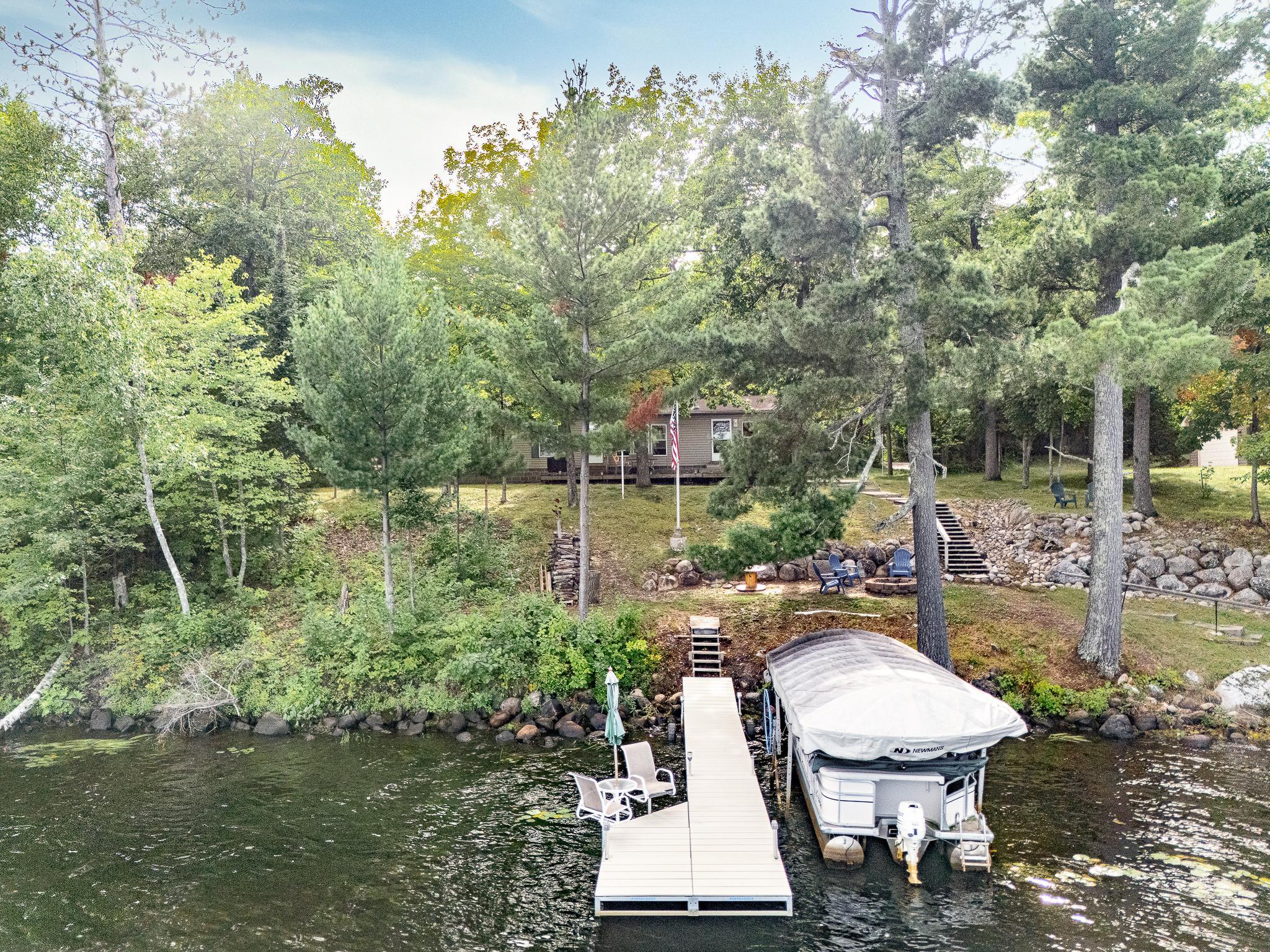 Seating at the end of the dock. Dock stays with the property. Beautiful trees on the property for shade and privacy.