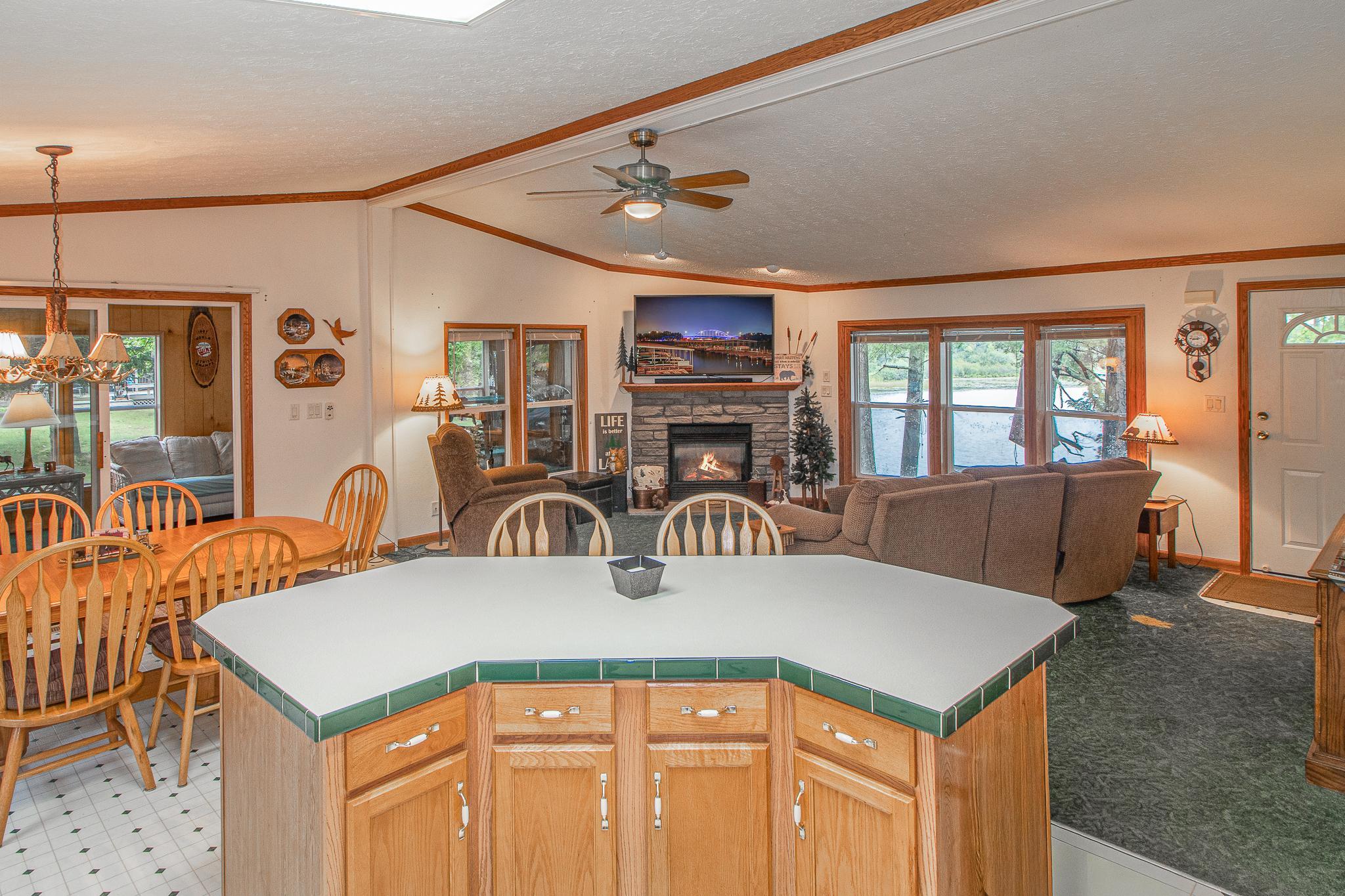 Open kitchen, dining and living with sliding doors off dining to porch living