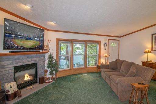 Lakeside views in living area with entry to outside deck