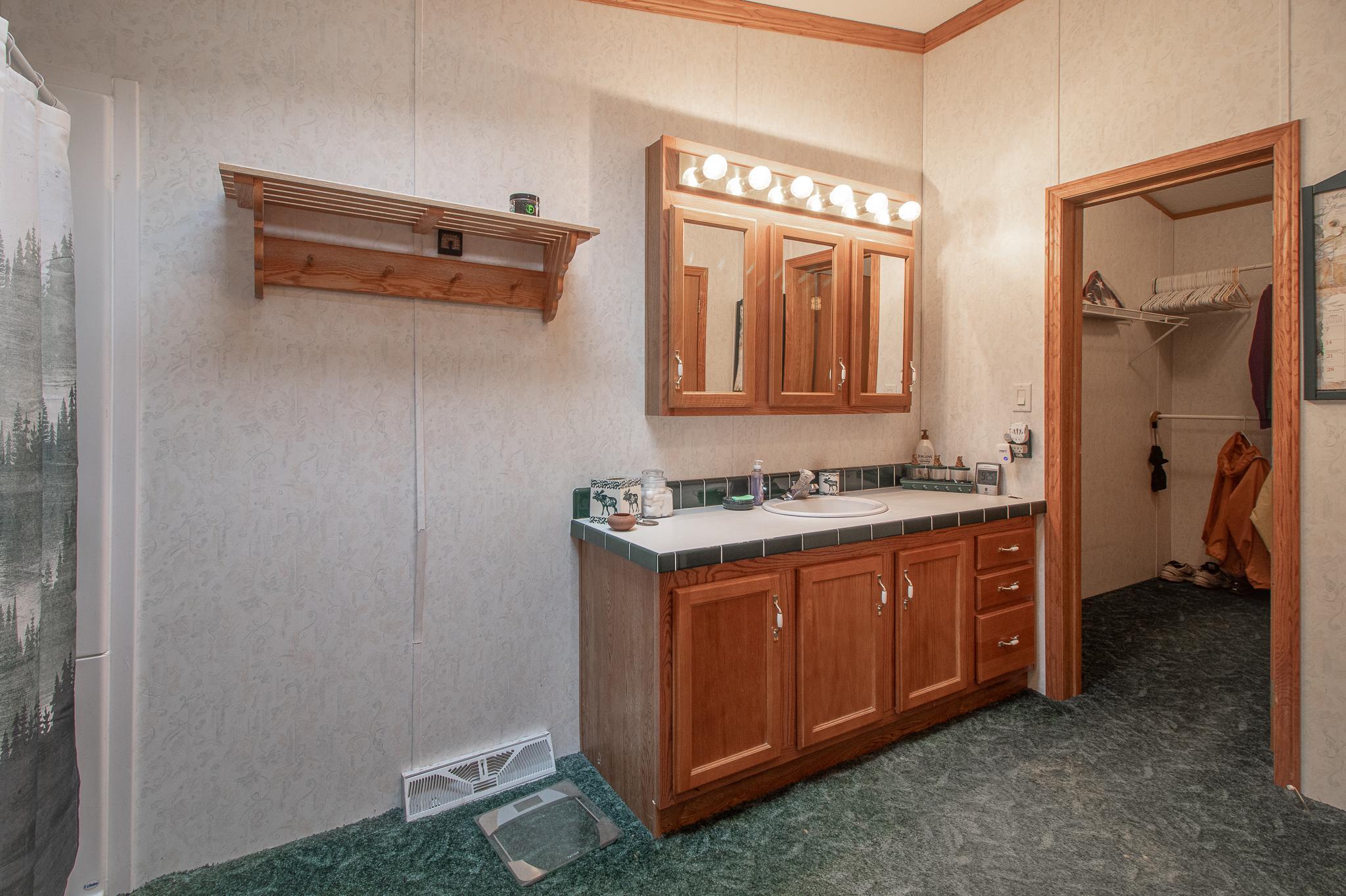 Vanity in primary with walk in closet