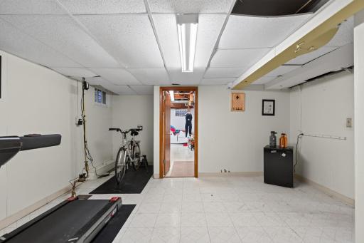 Lower level "bonus" room makes for a nice home gym space.