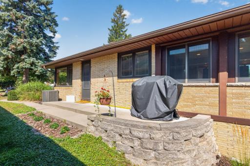 Side entrance off the kitchen provides a perfect space for grilling.
