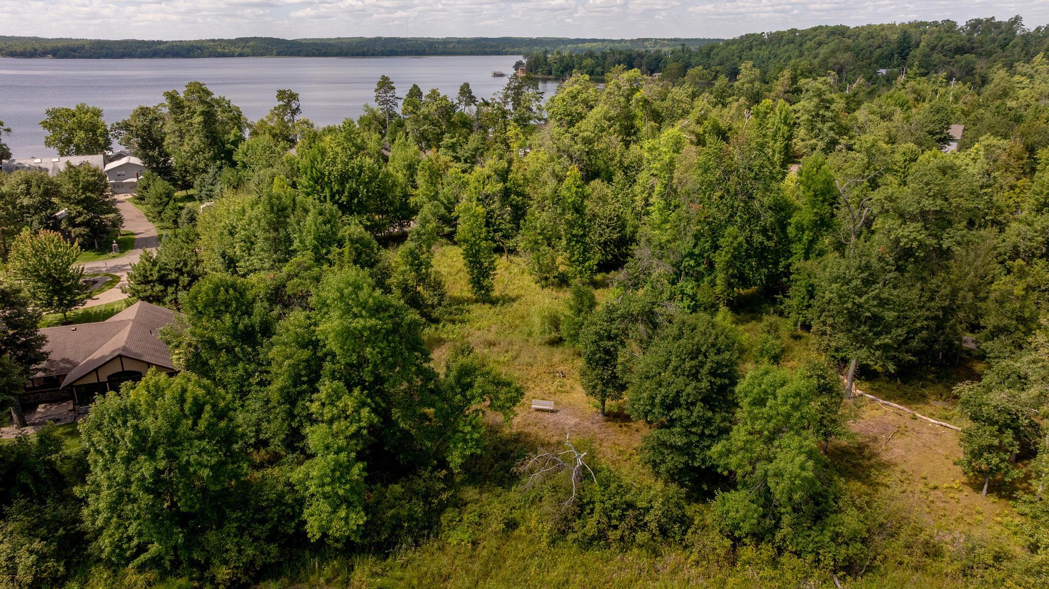 Open homesite surrounded by mature trees