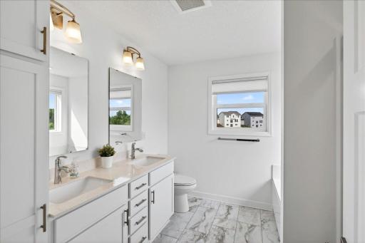 Primary En-Suite with walk-in shower and soaking tub