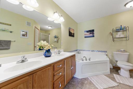 Primary bathroom with double sinks, jetted tub