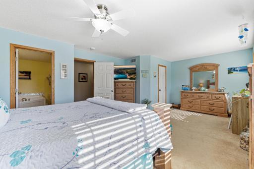 Primary bedroom has lighted step-in closet