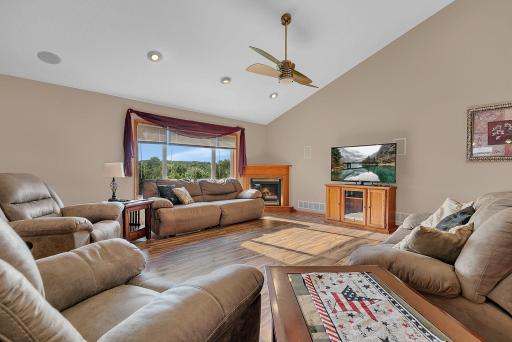 Large windows offer a ton of naturel light. The corner gas fireplace is perfect for those chilling evenings.