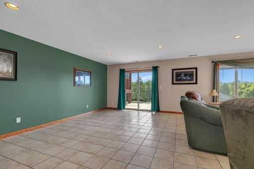 Another view of the lower level family room are showing the walk-out to the patio. Pride of ownership throughout this home really shines.