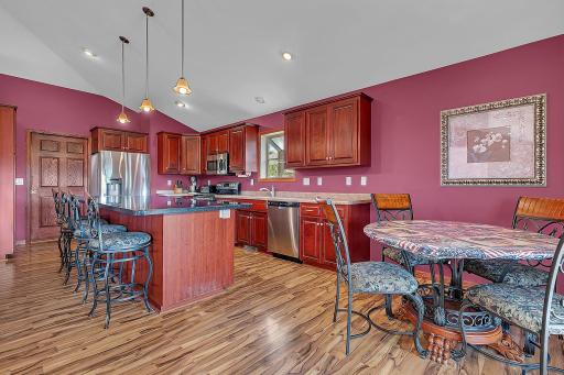 A chefs dream! The kitchen offers tons of cabinet and counter space. The far door leads to the laundry/mud room and 3/4 bath.