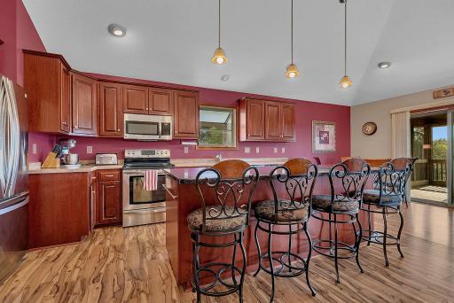 Welcome to your new gourmet kitchen offering cherry cabinets, stainless steel appliances, and granite center island.