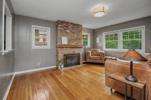 Den has gorgeous hardwood floors & gas fireplace
