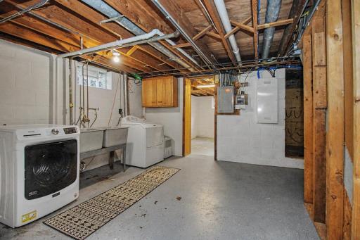 Large laundry area leads to a studio space and potential Fourth Bedroom