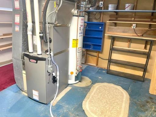 Lower Level Furnace/Storage Room with Lots of Shelving. Lennox Furnace (2024), Water Heater (2003), Upright Freezer (not shown)...