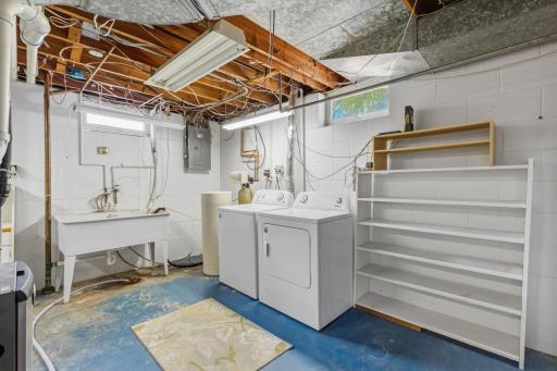 ...Culligan Water Softener, Amana Washer and Dryer, Double Basin Sink and Shelf Space! The New Electrical Panel and Hard Wired Smoke Detectors was Part of a 2024 Re-Wiring that also Included Hard Wired Smoke Alarms and Back Yard Exterior Lighting.