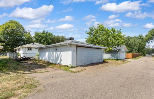 The 2.5 Car Garage is 23 ft Wide x 27 ft Deep, with a 16 x 7 ft Door. Additional Parking for Guests is Either on Lincoln Ave Out Front, or to the Left or Right of the Garage Out Back.