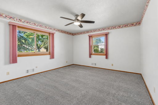 **NEW CARPET OCTOBER 8TH** Bedroom 1 is 14x13 ft with a Big Sliding Window Looking West and Another Facing North. A Large Closet is at Left.