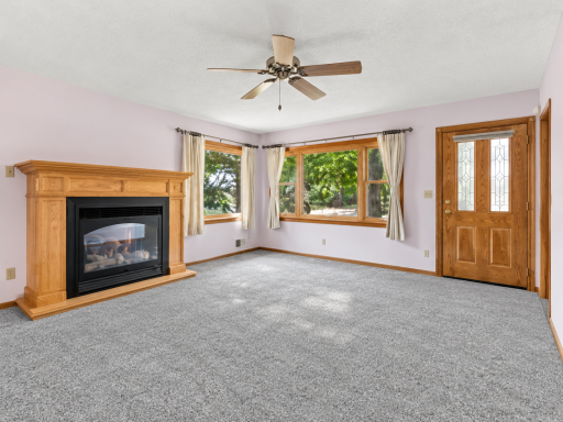 **NEW CARPET OCTOBER 8TH** Enjoy Cooler Evenings Ahead by the Gas Fireplace (2005). Notice the Corner Windows for Abundant Natural Light, with the Picture Window Facing West.