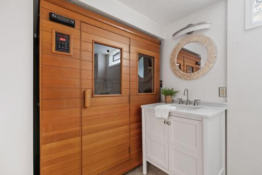 Enjoy a spa-like experience at home with a private sauna conveniently located in the lower-level 3/4 bathroom with walk in shower