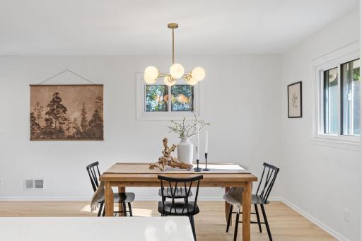 The open main level brings together the dining area, updated kitchen, and inviting living room for comfortable daily living and entertaining.
