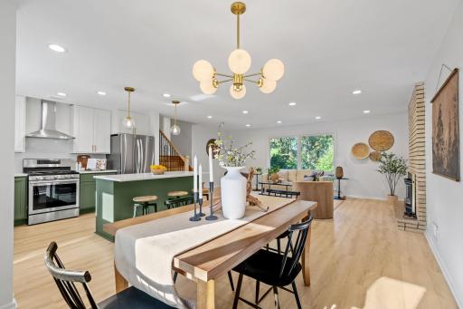 The open-concept layout seamlessly connects the updated kitchen, dining area, and living room—creating the perfect setting for everyday living and entertaining
