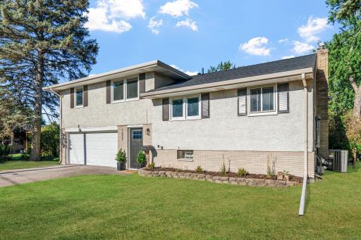 This well-maintained exterior features attractive curb appeal, updated windows, mature trees, and welcoming front landscaping.