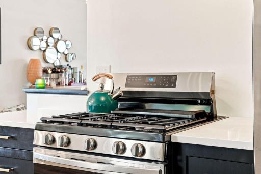 The stunning stainless steel five-burner gas range delivers both style and performance.