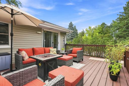 Extend your living space outdoors onto the large entertaining deck where you can watch boats drive by on Upper Twin Lake create the perfect backdrop for everyday living and memorable gatherings.