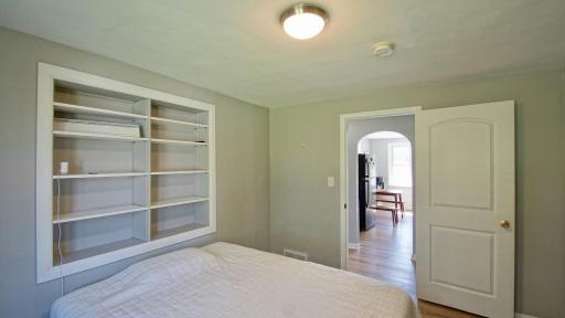 Interior view of bedroom. The kitchen is through the doorway across the hall.