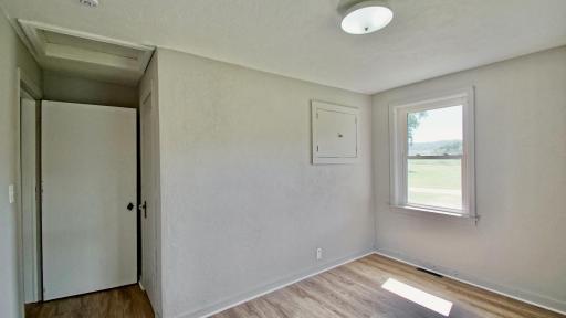 Interior view of third bedroom. Extra storage compartments are a bonus. This room would make a great office or hobby room too!