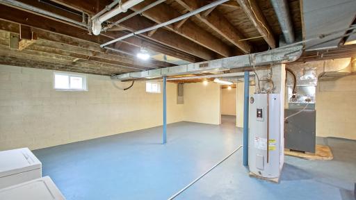 Spacious, unfinished lower level offers exceptional flexibility to create your ideal recreation room, home gym, or guest suite.