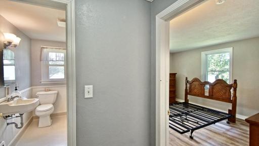 Primary bedroom is on the right and full bath is to the left.