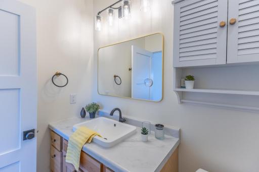 Primary bathroom vanity with generous counter and storage space.