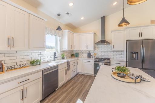 Spacious kitchen with abundant cabinetry, stainless appliances and plenty of workspace.