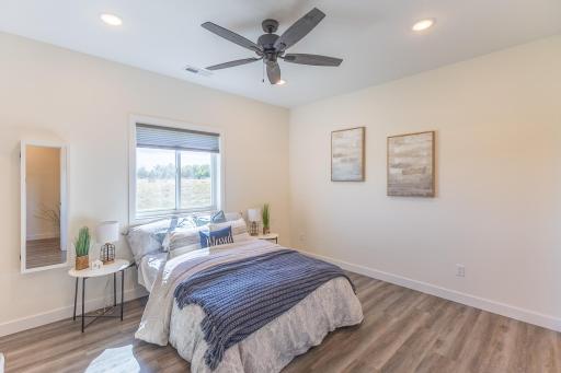 Primary bedroom with plenty of natural light and easy access to the private bath and closet.