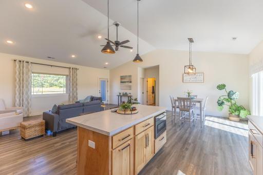 Another view of the open-concept kitchen, dining and living spaces.