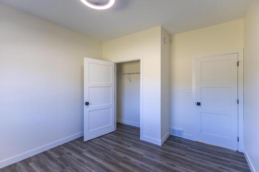 Additional view of the third bedroom and closet space.
