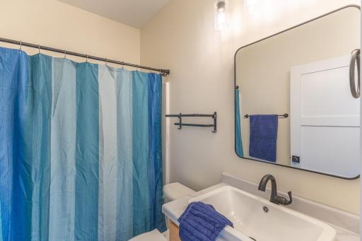 Full guest bathroom conveniently located near the secondary bedrooms.